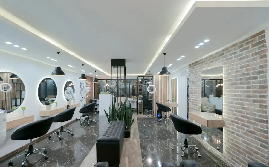 A bright modern hair salon with round mirrors